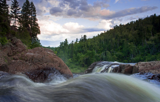 Water flowing over the edge of High Falls | Tettegouche State Park