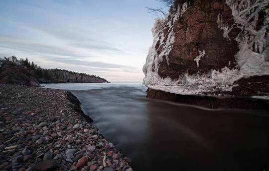 Baptism Riiver flowing into Lake Superior and ice covered rocks following two-day winter storm - Tettegouche State Park