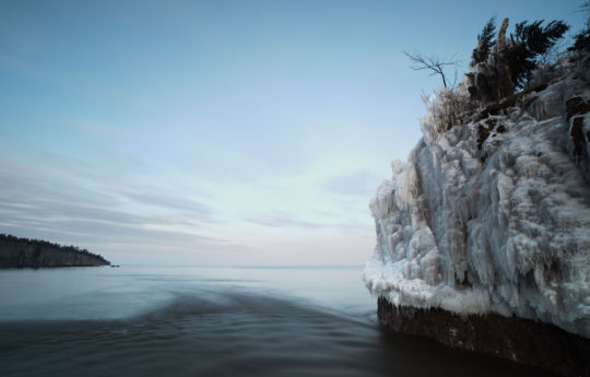 Twilight and ice covered rocks at the mouth of the Baptism River - Tettegouche State Park